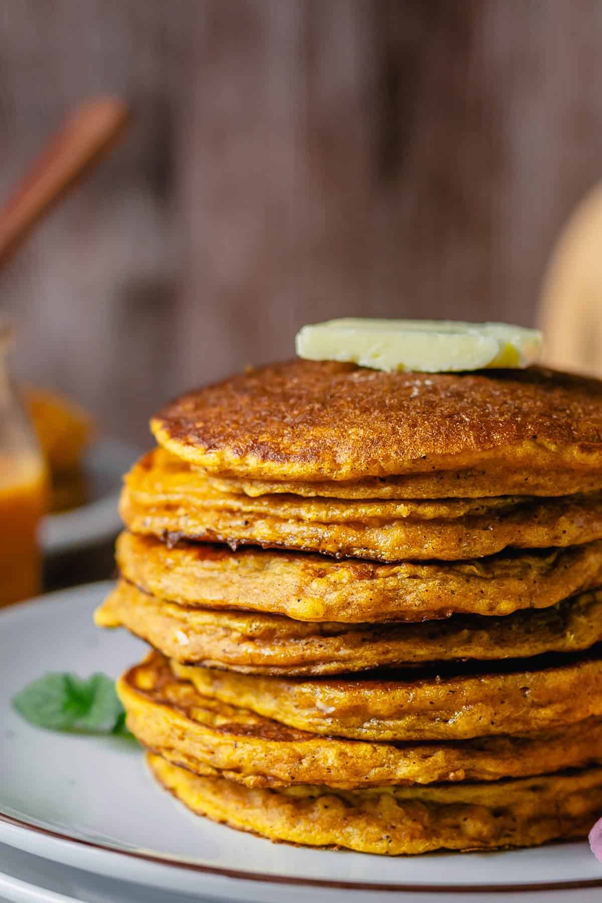 Stacked pumpkin pancakes side view angle