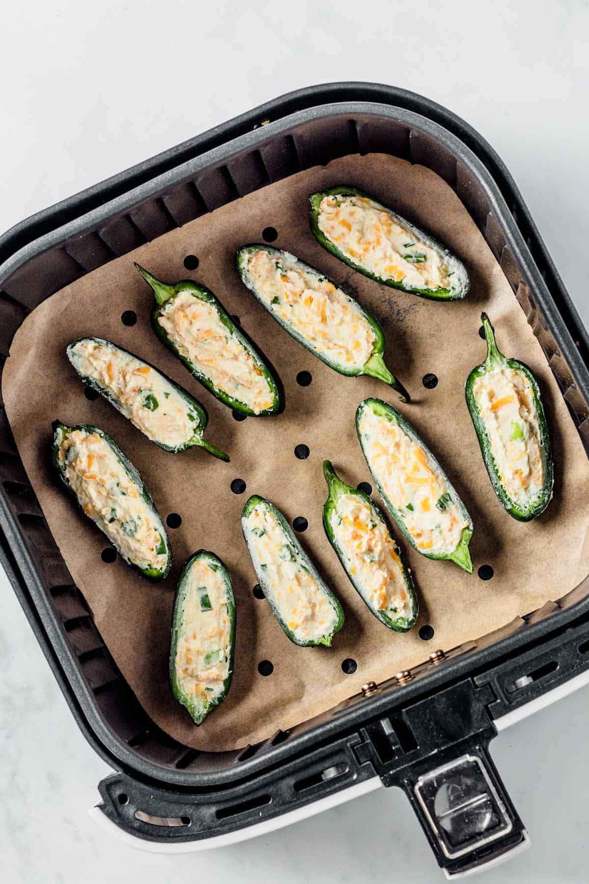 jalapeno poppers in air fryer before cooking