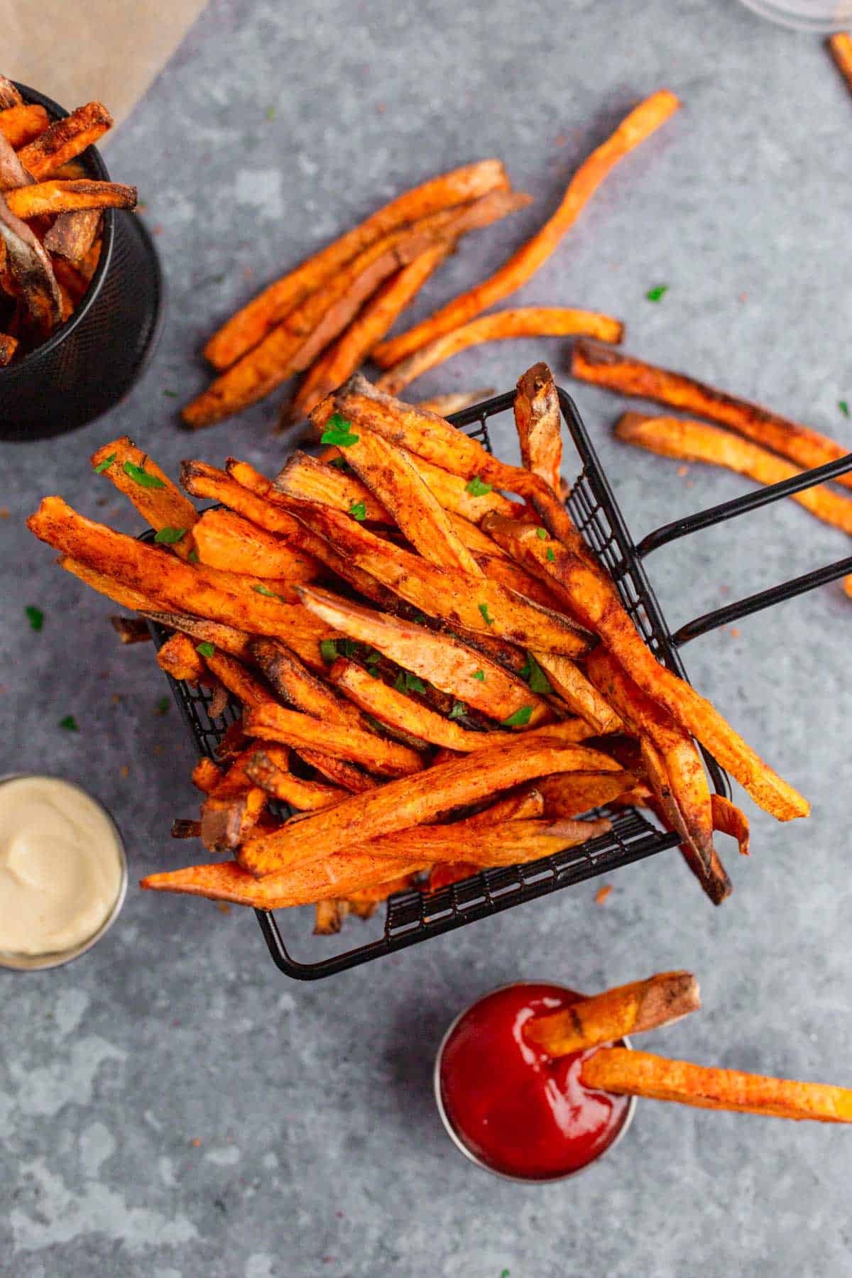 Air Fryer Sweet Potato Fries with parsley and mayonnaise