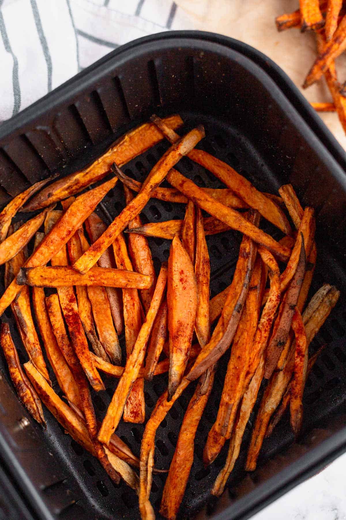 Air Fryer Sweet Potato Fries in air fryer basket