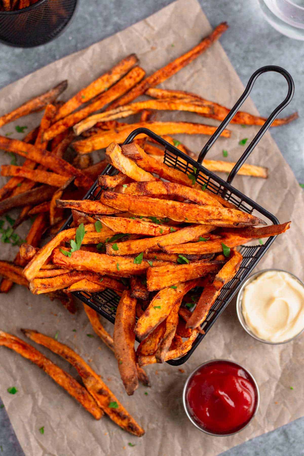 Air Fryer Sweet Potato Fries with parsley and mayonnaise