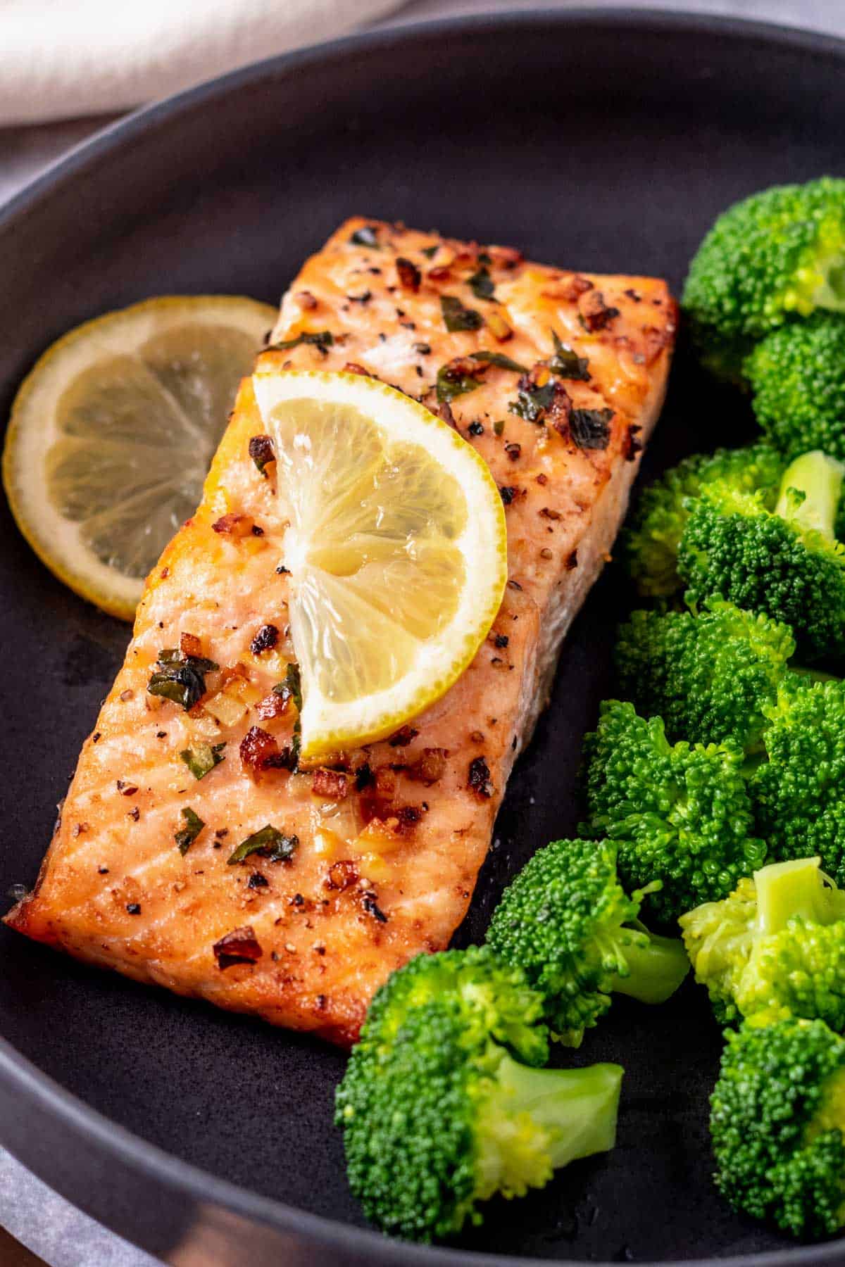 salmon fillets with broccoli and lemon a plate
