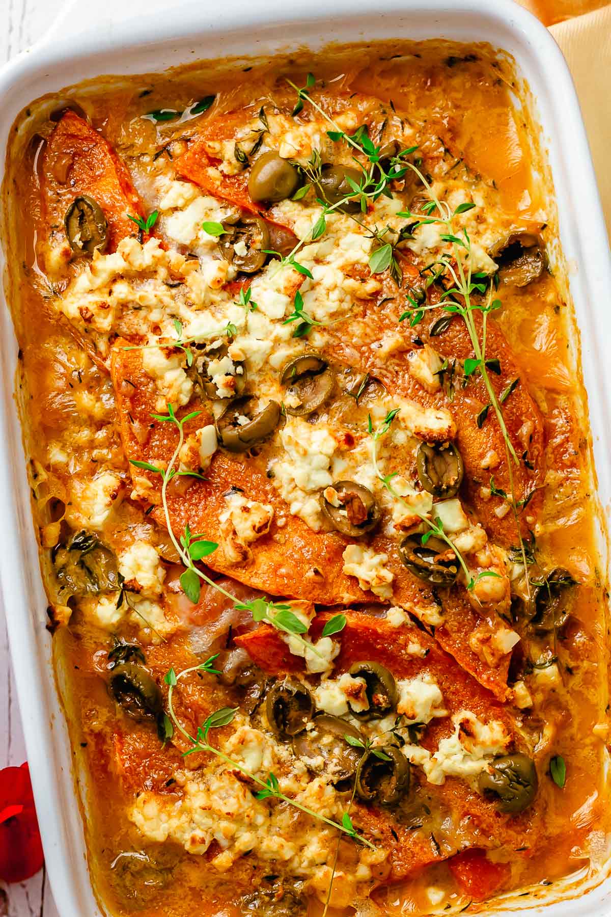 Bacon Pumpkin Bake with olives, feta and thyme in coconut sauce