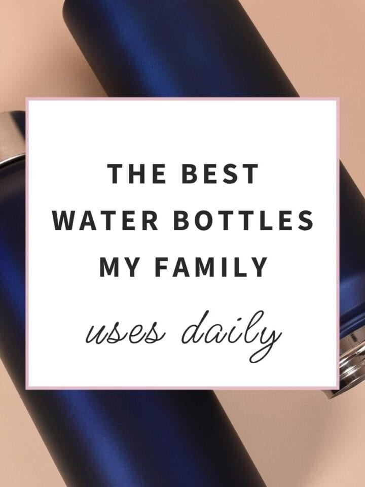 Two matte navy stainless steel reusable water bottles with silver caps placed on a light beige background, representing durable insulated water bottles for everyday hydration, work, school, travel, and outdoor activities.