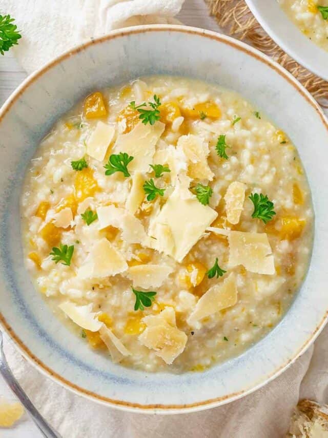 top shot of a pumpkin risotto in a light blue bowl