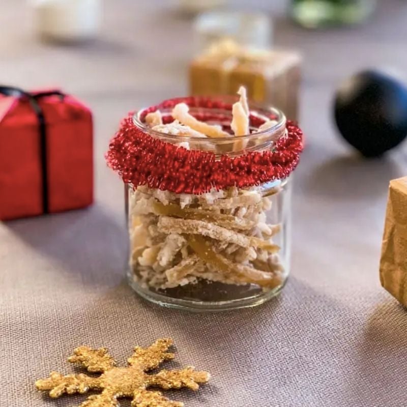 Candied Ginger in a small glass jar wrapped with red ribbon