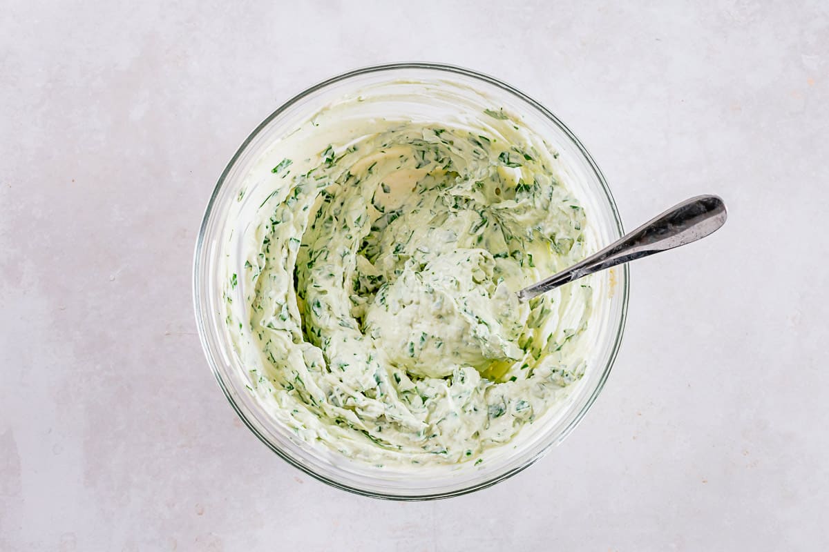 codl spinach dip ingredients mixed in a transparent bowl