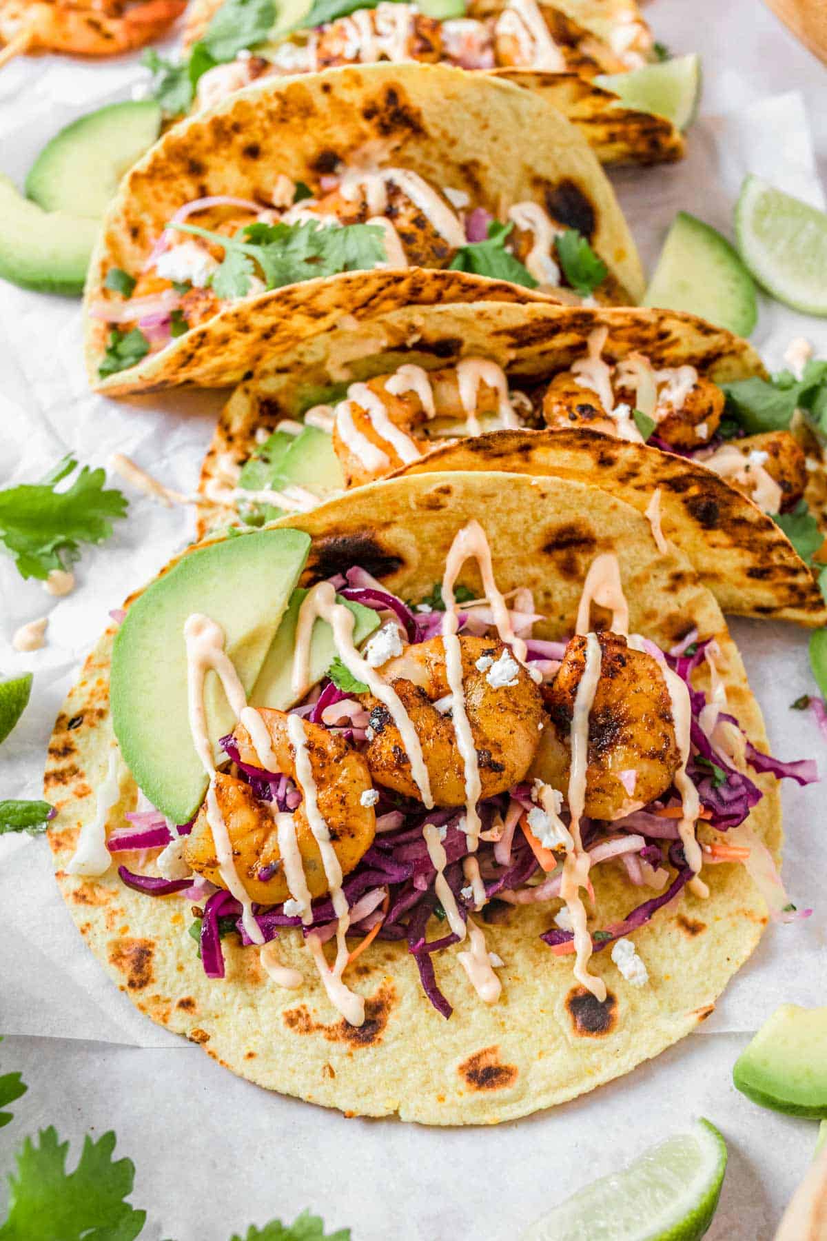 close up shot of grilled Shrimp Tacos with spicy mayonnaise and coleslaw