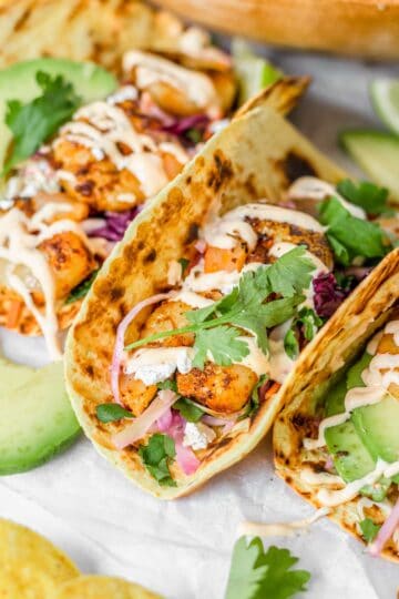 close up shot of grilled Shrimp Tacos with spicy mayonnaise and coleslaw