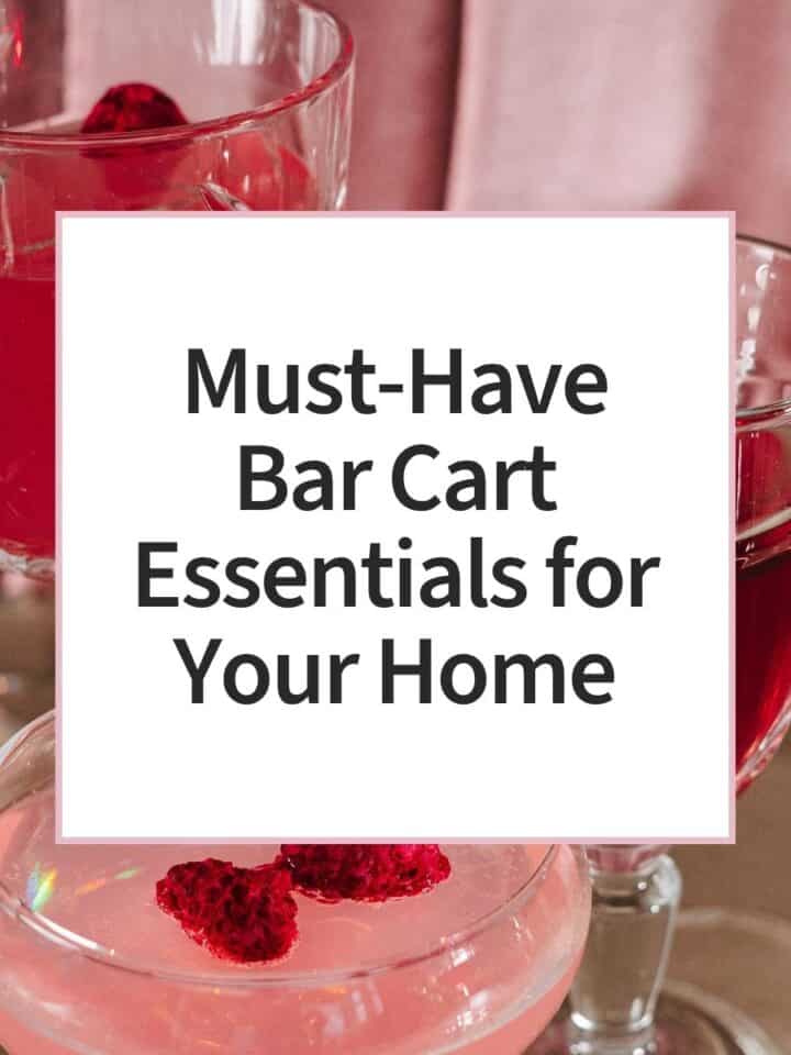 Three elegant glasses filled with pink berry cocktails or mocktails, garnished with raspberries and served on a table, creating a festive summer entertaining atmosphere.