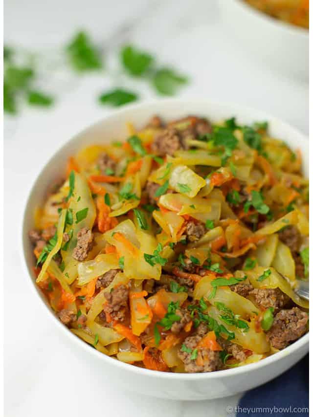 fried ground beef and cabbage in a white bowl angle shot