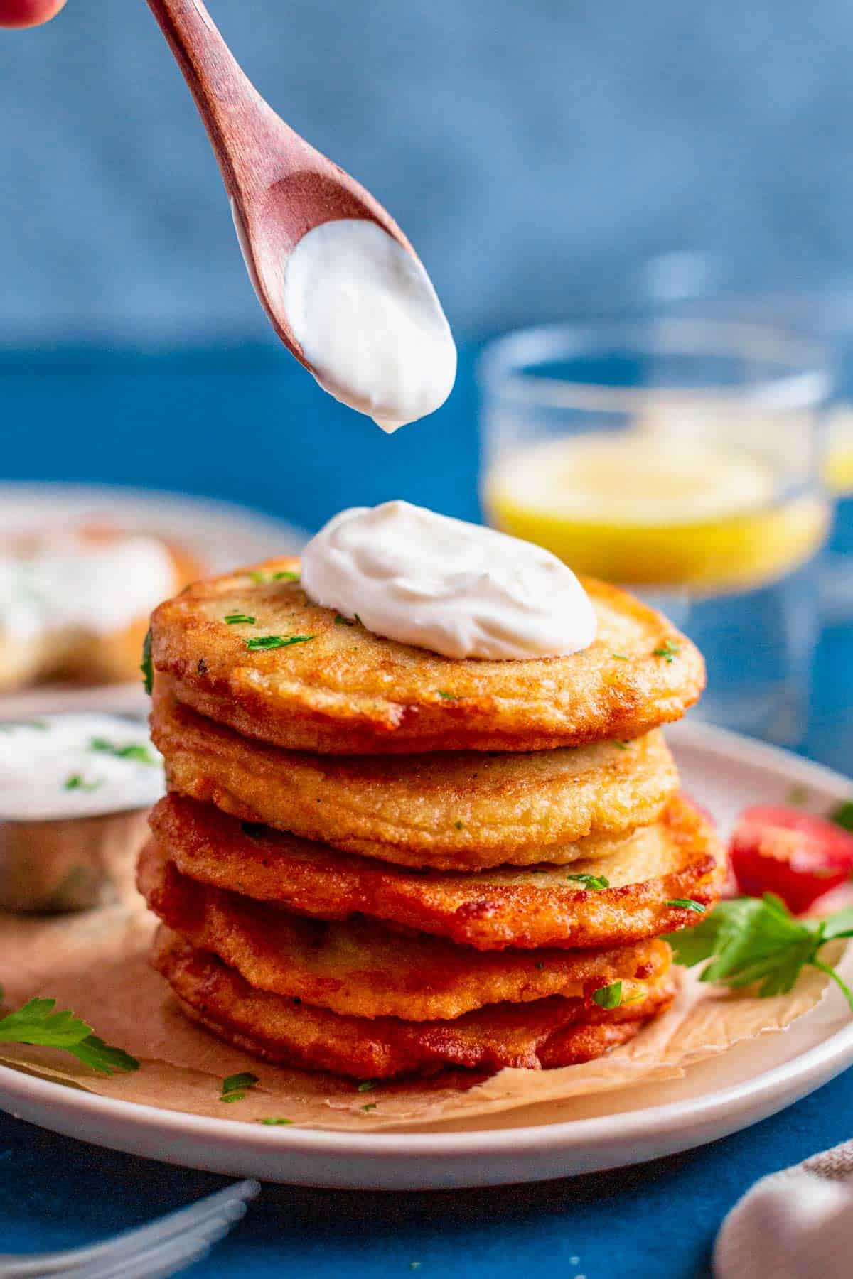 stack of gluten free potato pancakes with sour cream