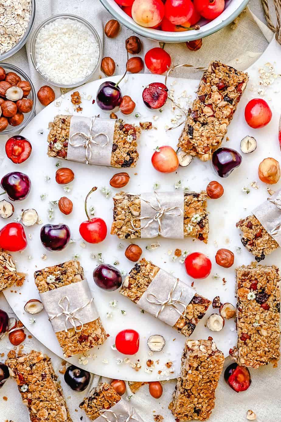 This Hazelnut Cherry Granola Bars recipe is made with wholesome, simple, healthy ingredients that are sure to be sitting in your kitchen pantry shelf and waiting for you to make these delicious snacks. These granola bars are dairy free, gluten free, so tasty and fun to make. - The Yummy Bowl