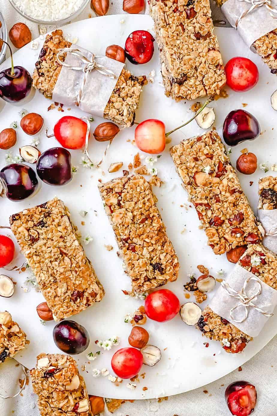 This Hazelnut Cherry Granola Bars recipe is made with wholesome, simple, healthy ingredients that are sure to be sitting in your kitchen pantry shelf and waiting for you to make these delicious snacks. These granola bars are dairy free, gluten free, so tasty and fun to make. - The Yummy Bowl