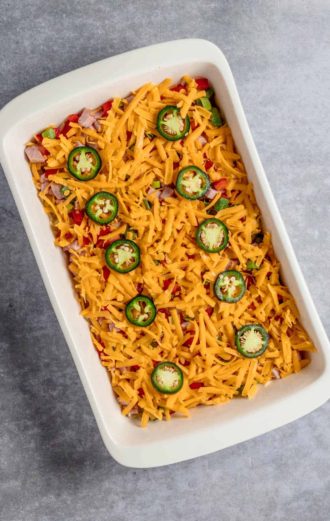 cheese and jalapeno added to hashbrown casserole dish