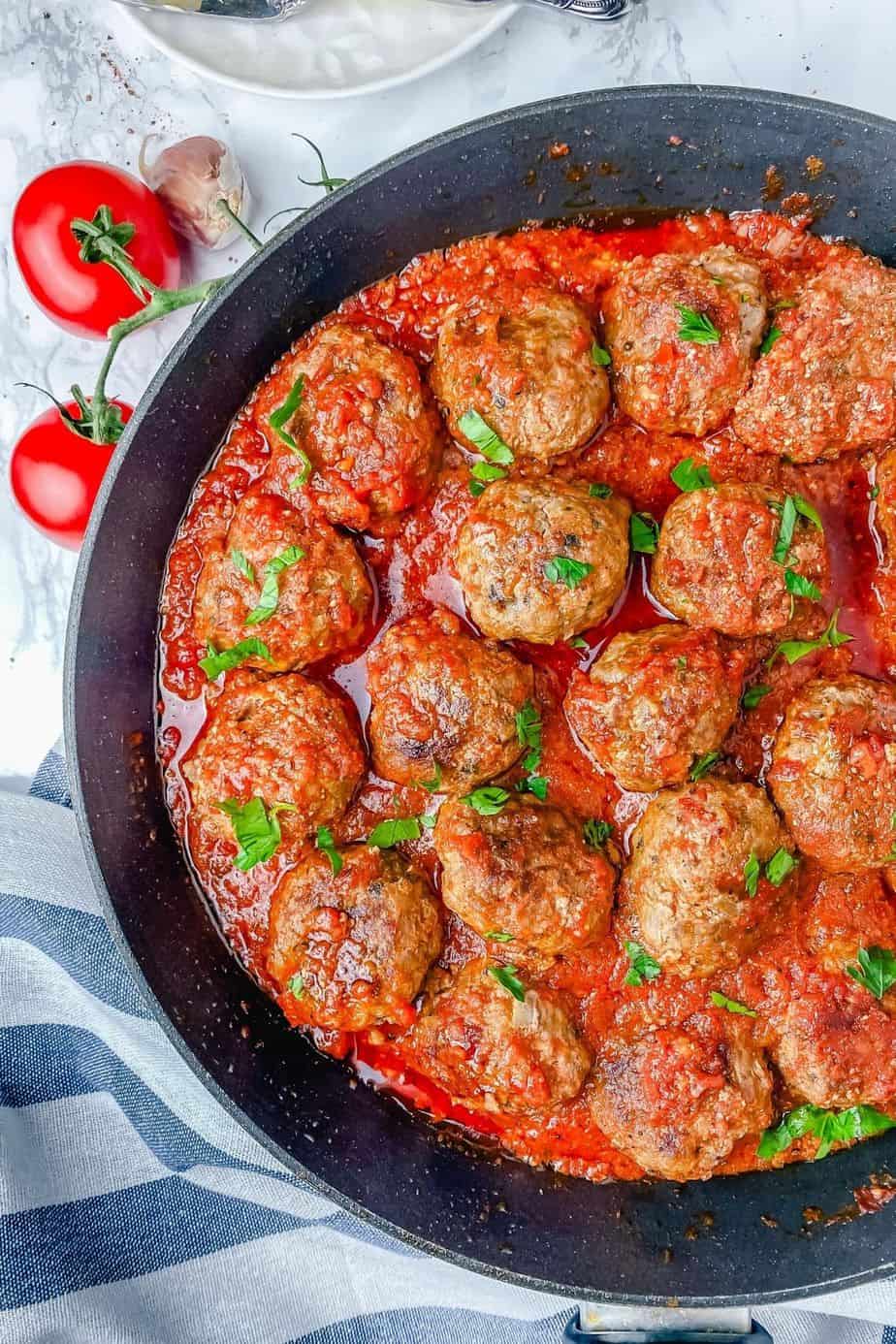 These easy meatballs in tomato sauce are made with pork and beef ground meat. A delicious blend of flavors and a dinner recipe that you can’t go wrong with. Guaranteed to feed and satisfy your family or guests in no time - The Yummy Bowl