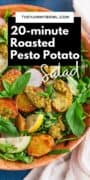 pesto potato salad in a wooden bowl