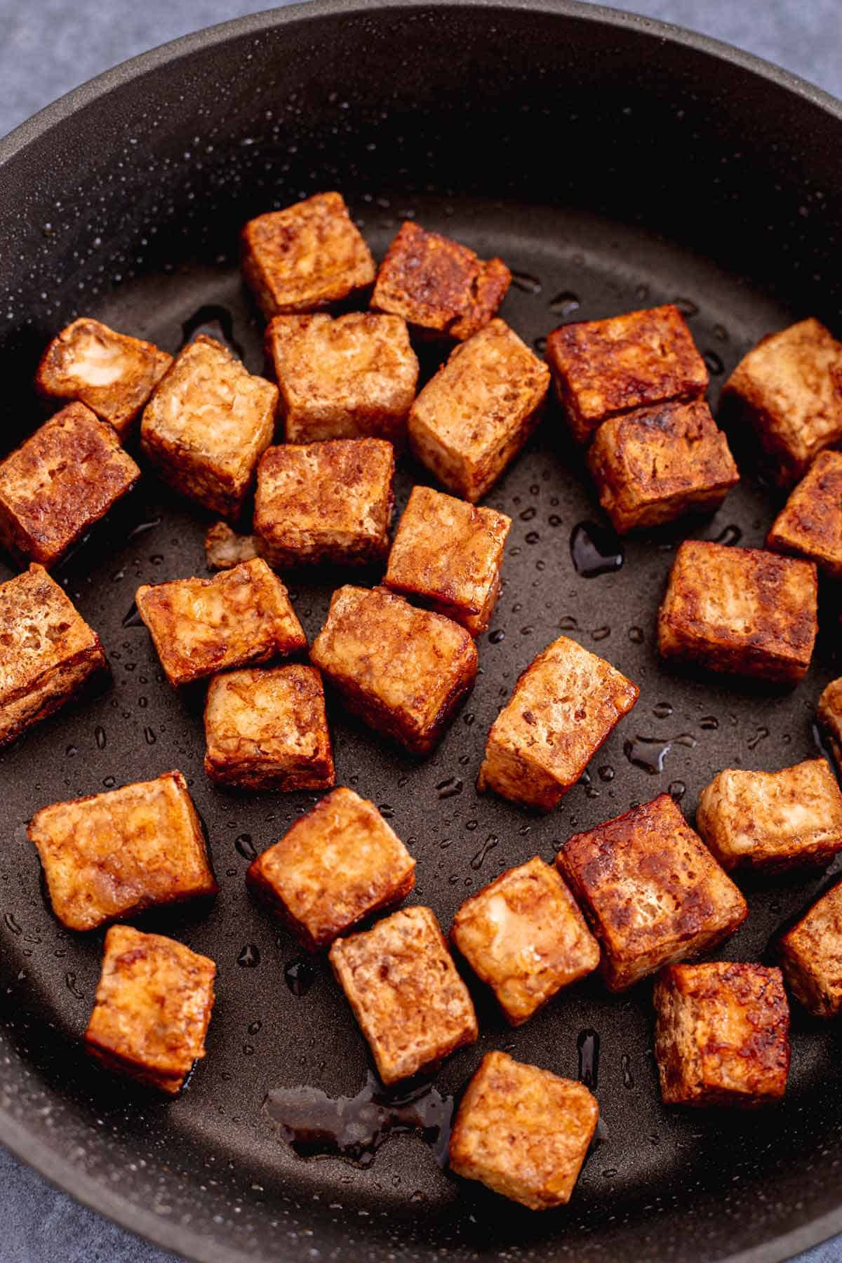 pan fried tofu cubes with cornstarch and soy marinade