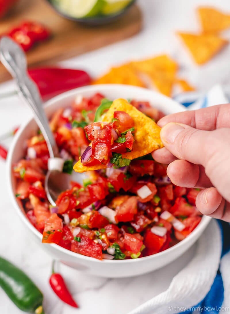 pico de gallo (mexican tomato salsa) in a bowl with tortilla chips