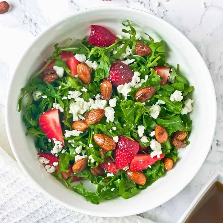 This Strawberry Arugula Salad with Caramelized Almonds is one of my favorite salads to make. It’s easy, flavorful and great for side dishes or served with grilled chicken as a wholesome dinner. Top it up with a light olive oil based salad dressing for a perfect finish. - The Yummy Bowl