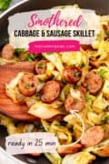 a wooden spoon in the cabbage with sausage skillet