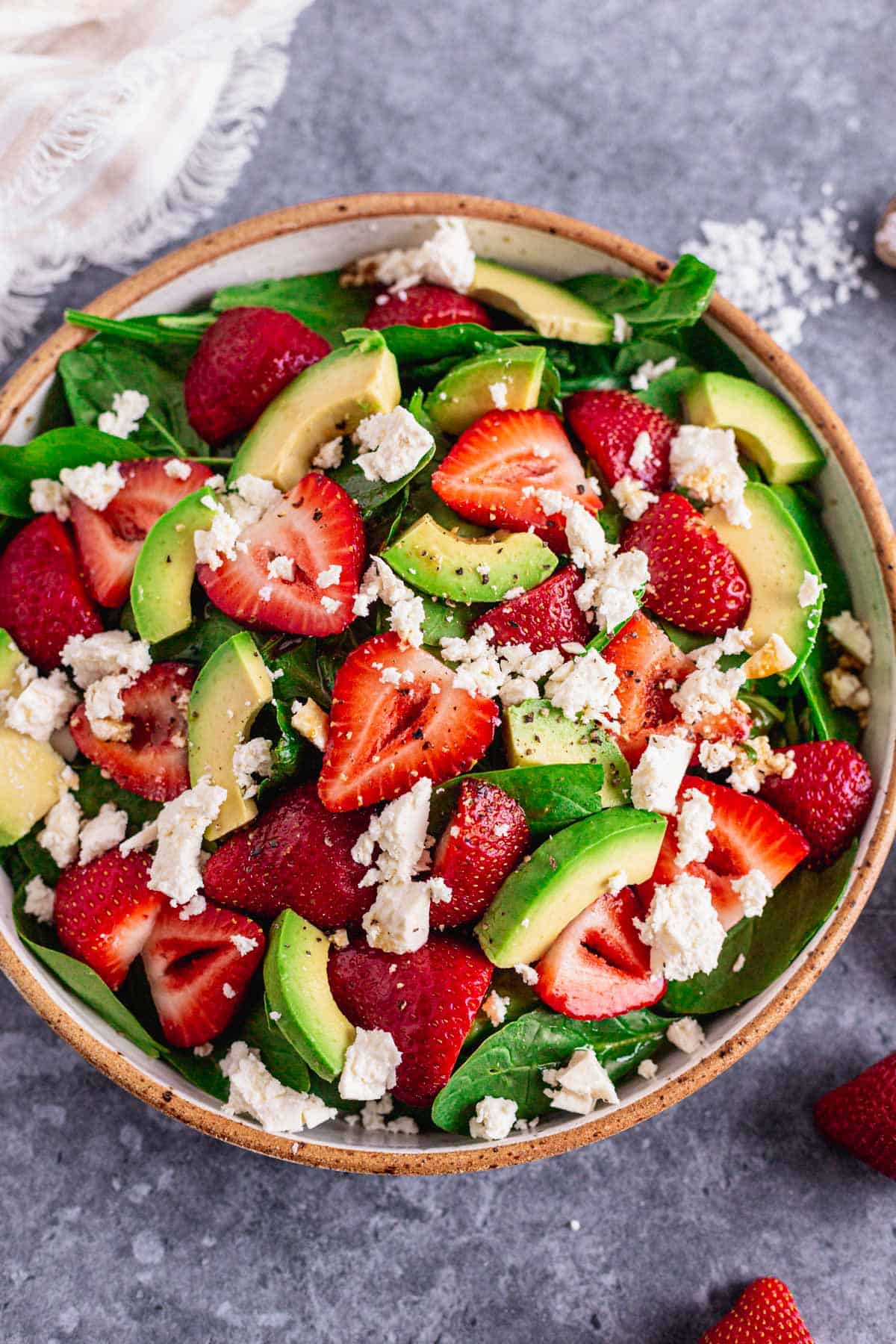 Spinach Strawberry Salad With Feta in a bowl