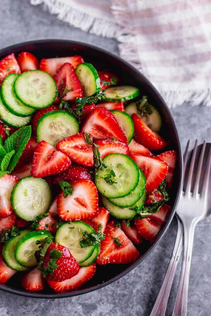 Cucumber Strawberry Salad in a black bowl