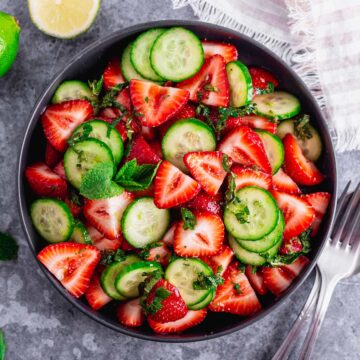 Cucumber Strawberry Salad in a black bowl
