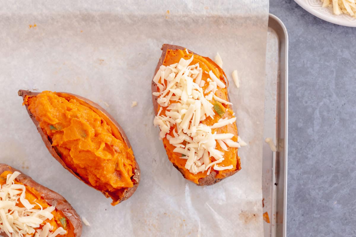 Twice Baked Sweet Potato topped with cheese before baking