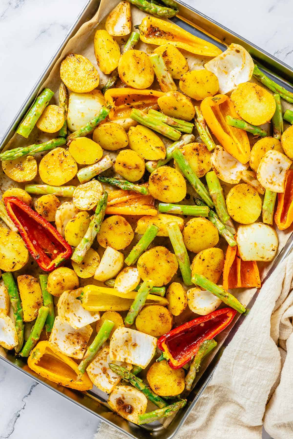 vegetables in a sheet pan before baking