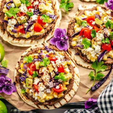 tostadas with toppings on a brown parchment paper