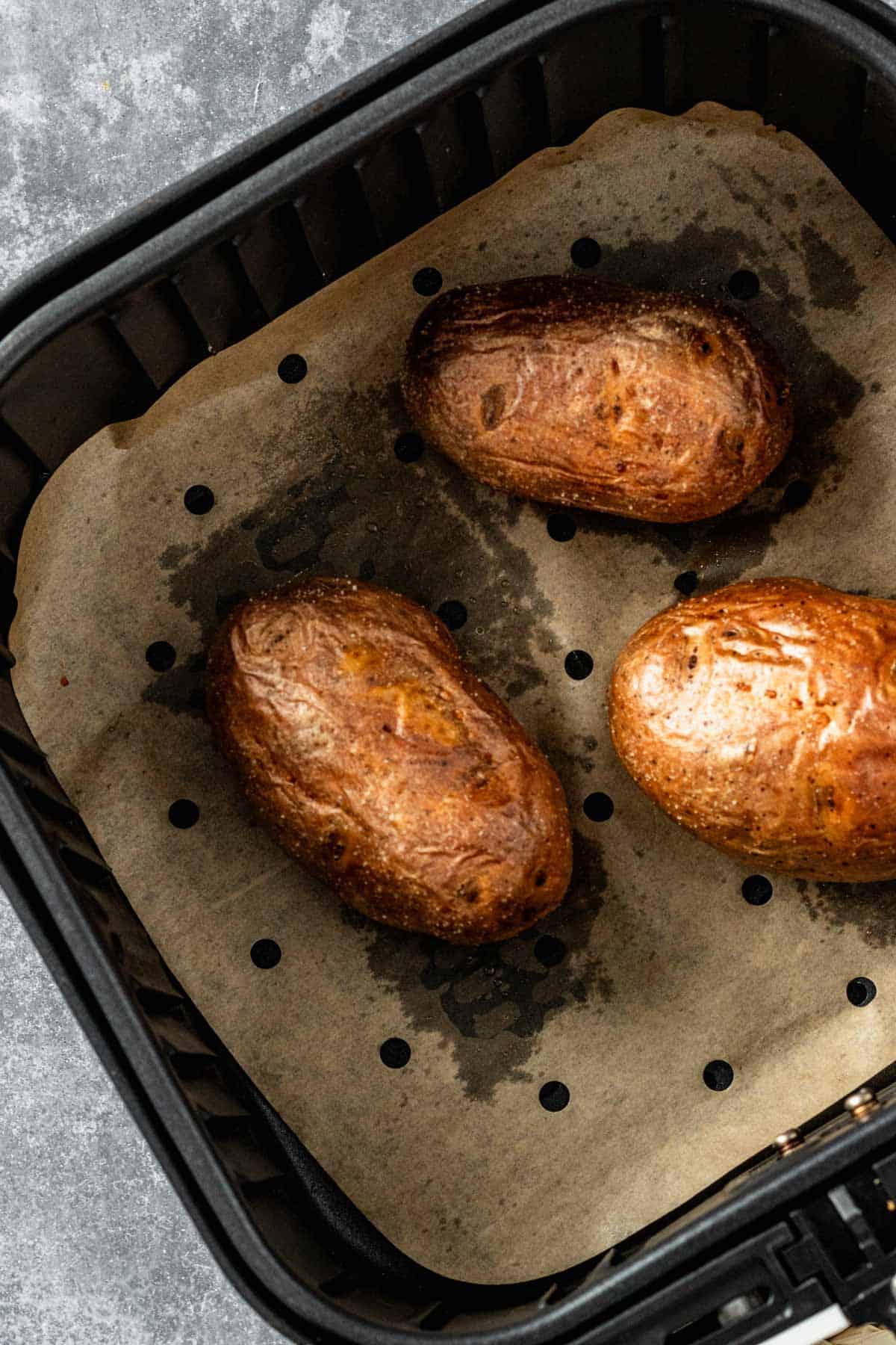 freshly baked whole potatoes in air fryer.