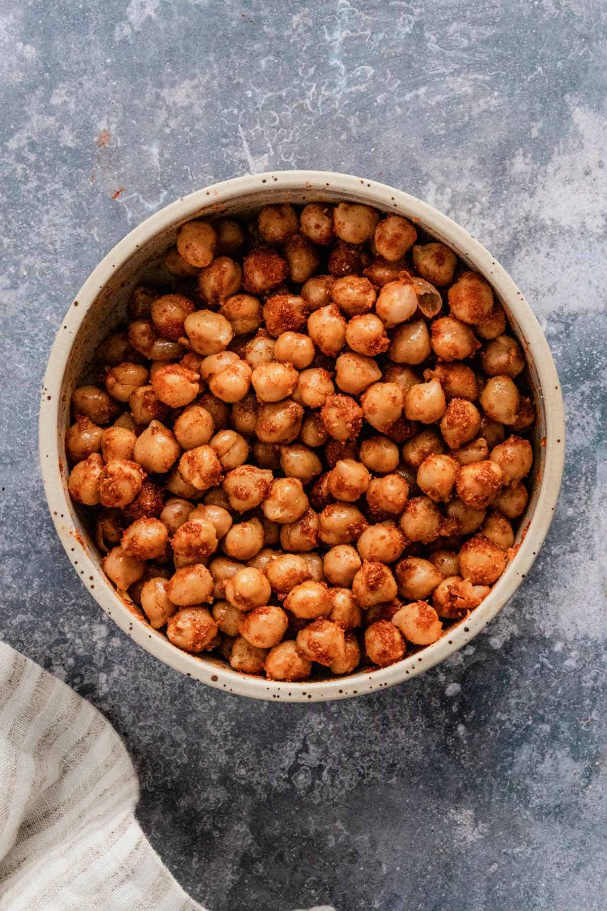 canned chickpeas in a bowl with seasonings