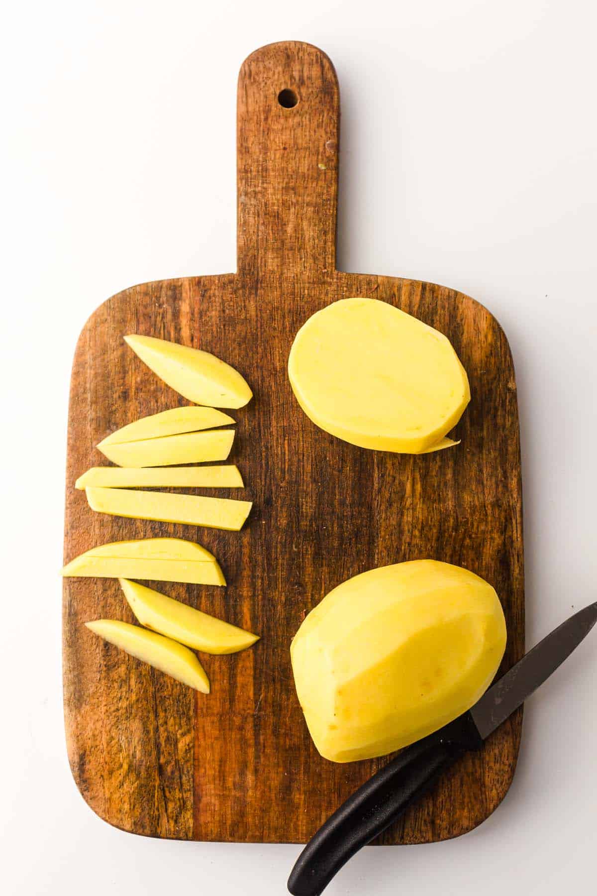 cutting potatoes for fries.