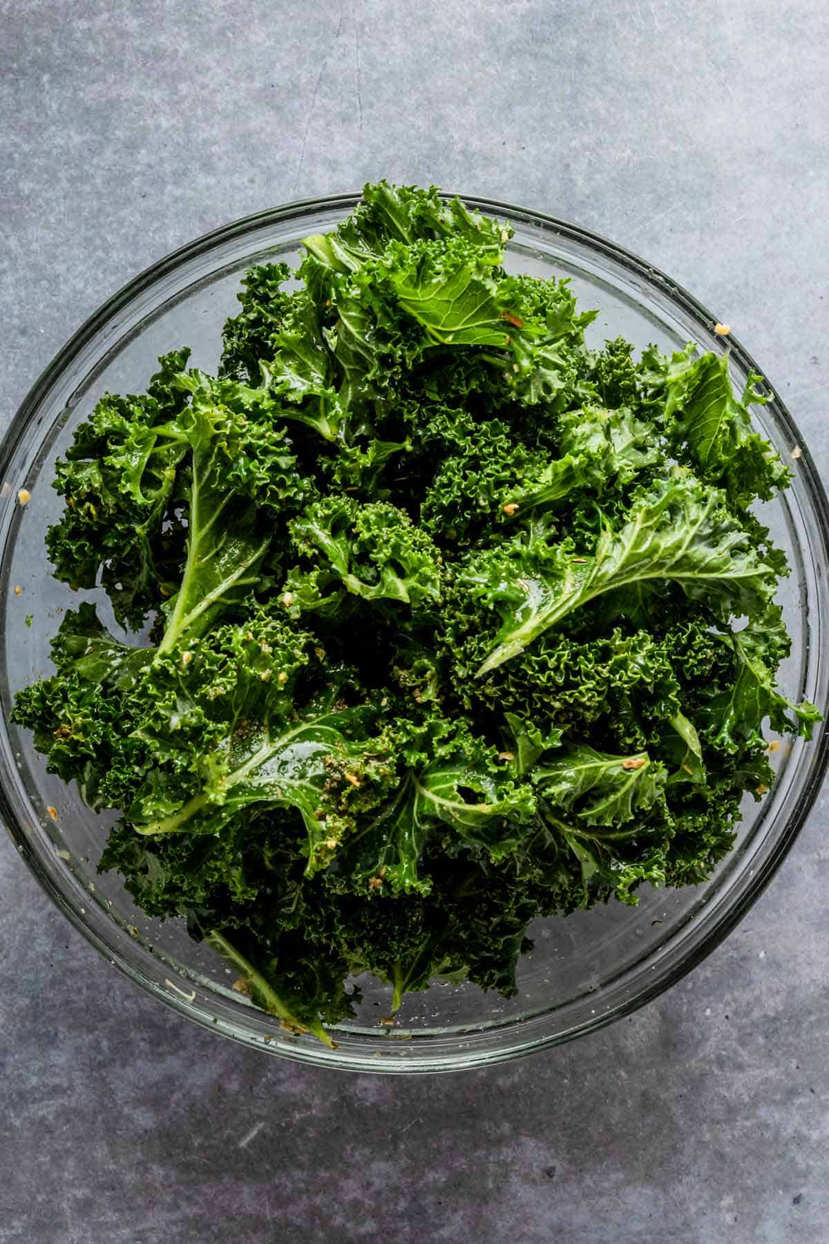 kale in a bowl with seasonings