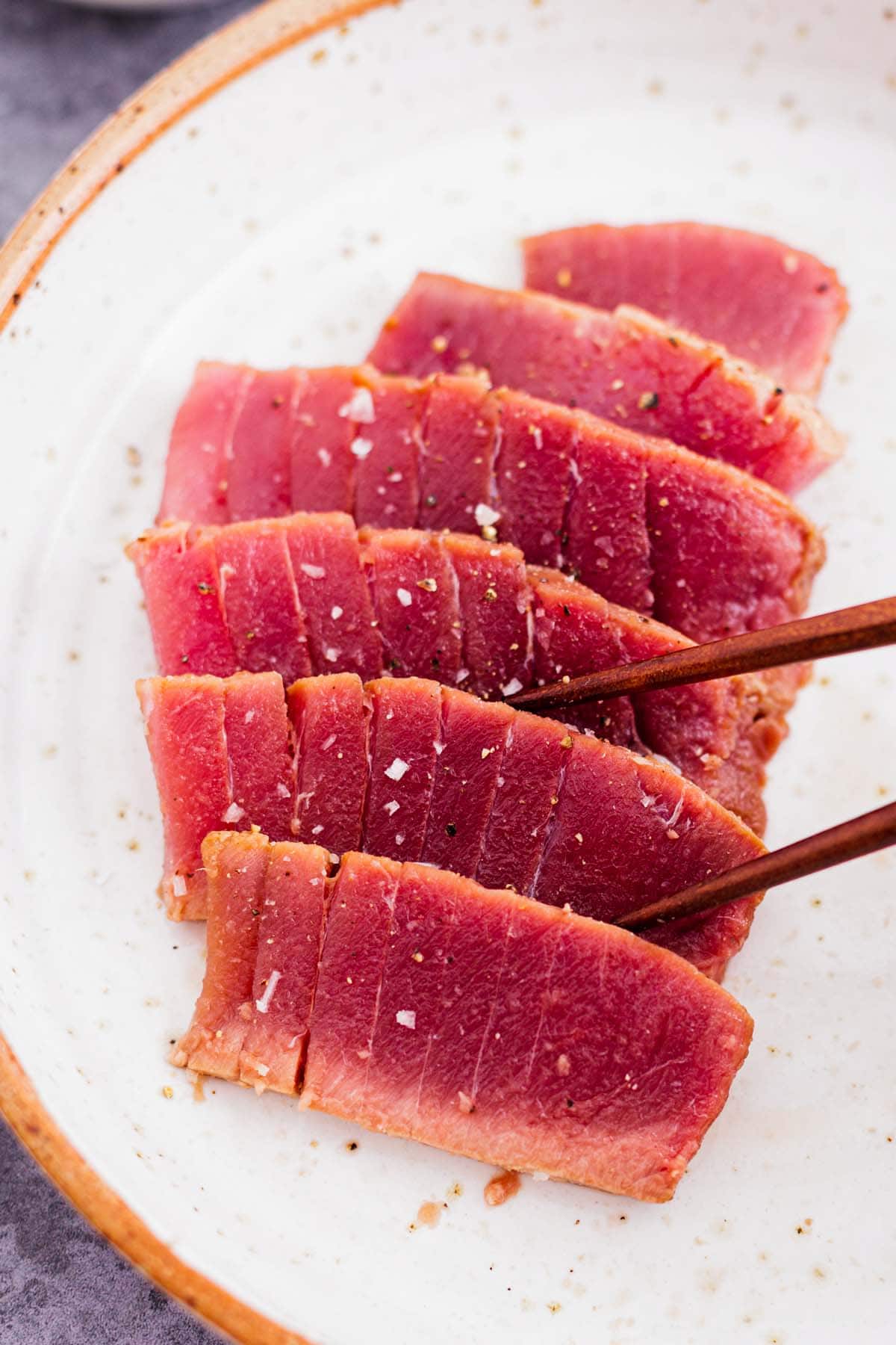 air fryer tuna steak on a bed of cauliflower puree and tomato salsa