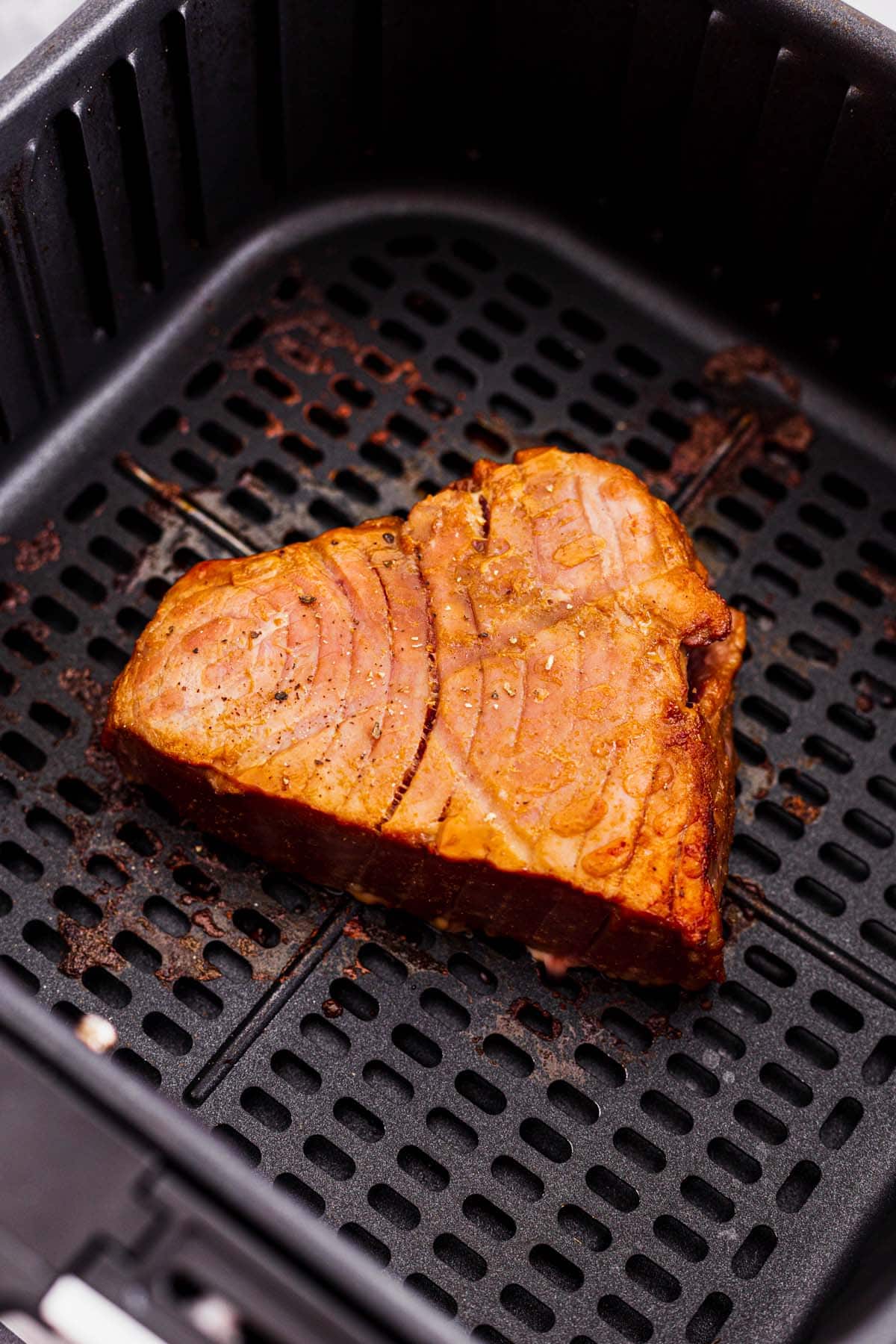 air fryer tuna steak after frying in an air fryer basket