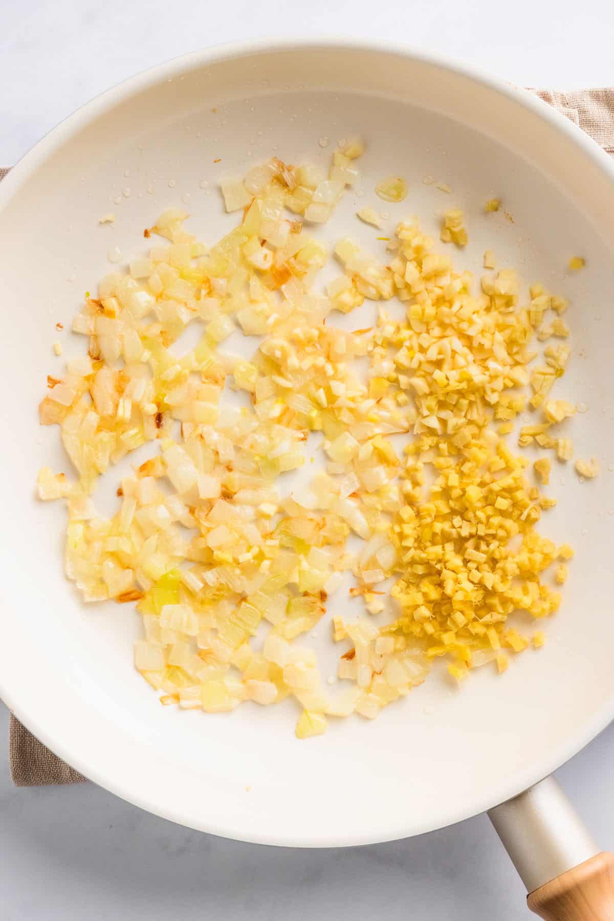 Chopped onions and minced garlic prepared for cooking.