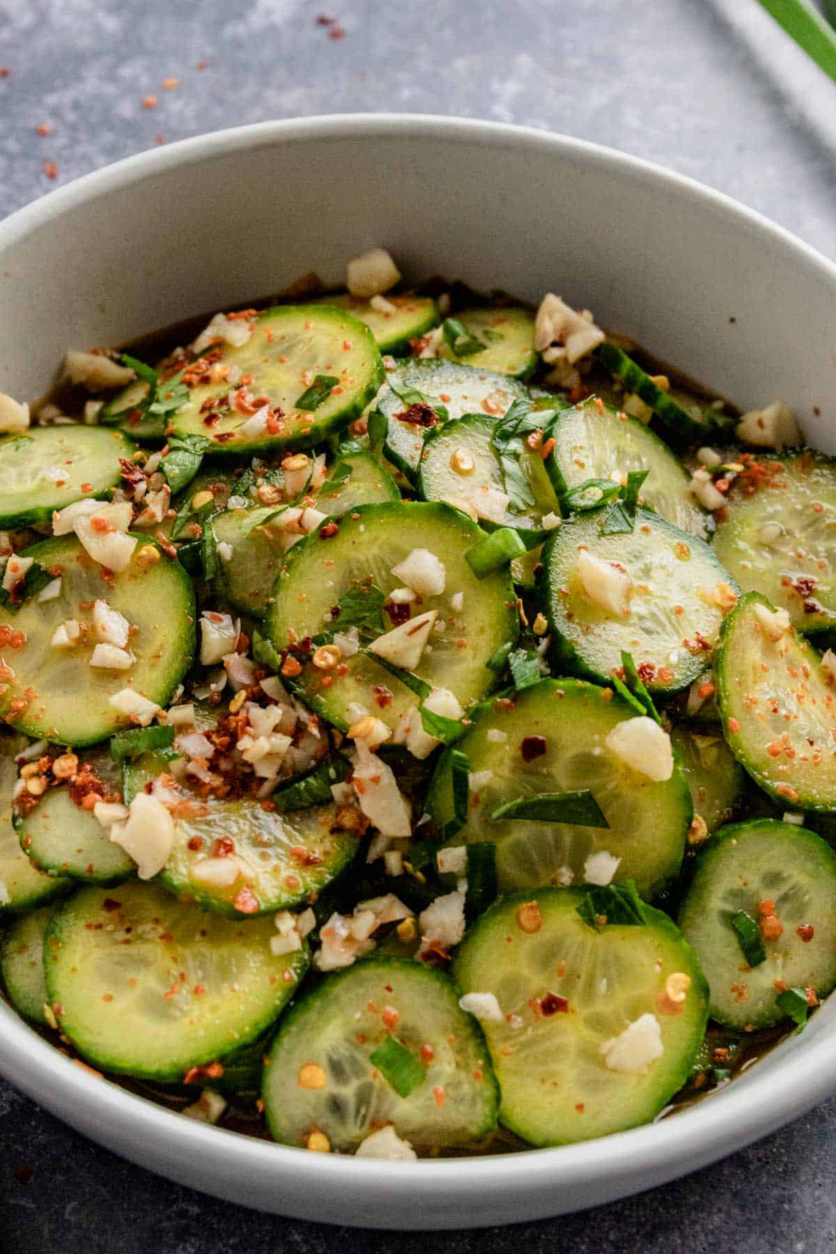 spicy cucumber salad with sesame oil in a bowl