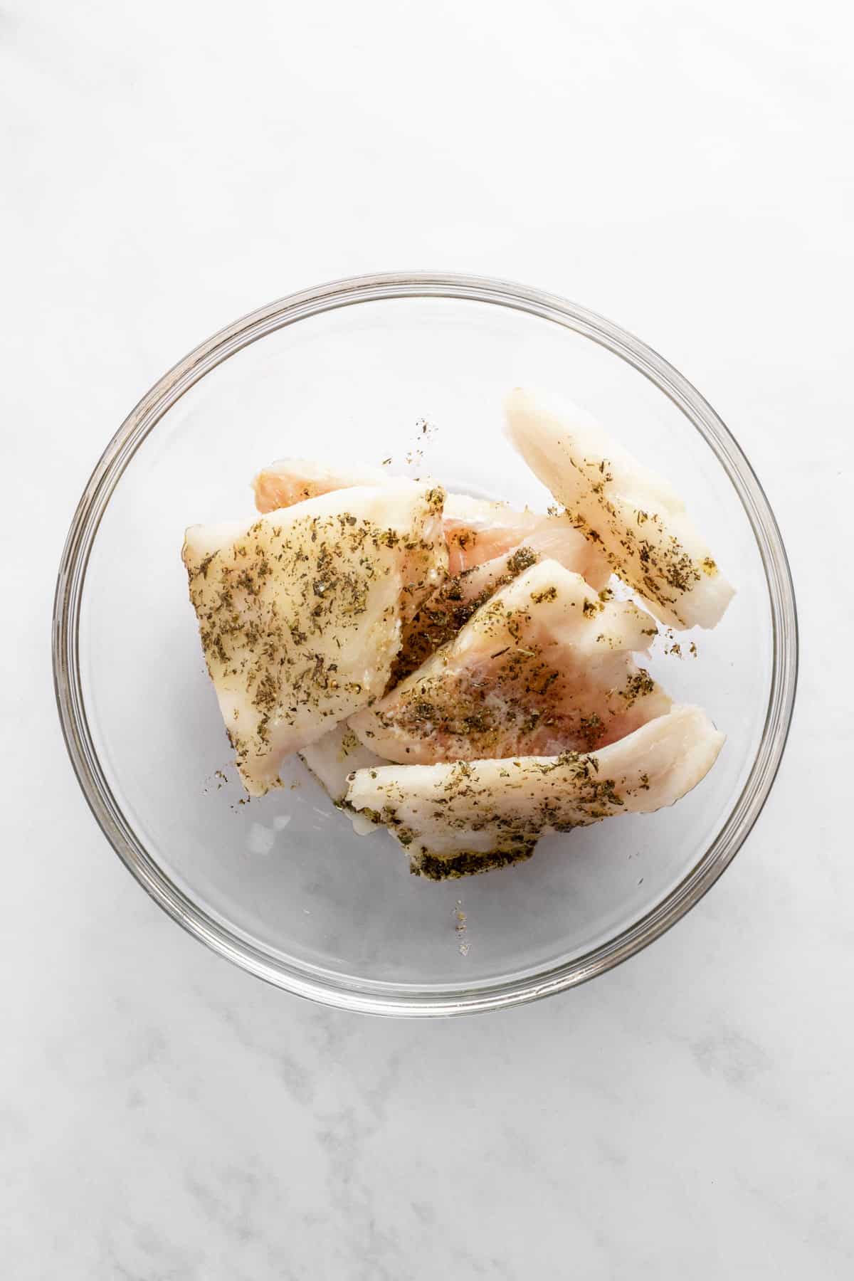 cod fillets mixed with olive oil and dried herbs