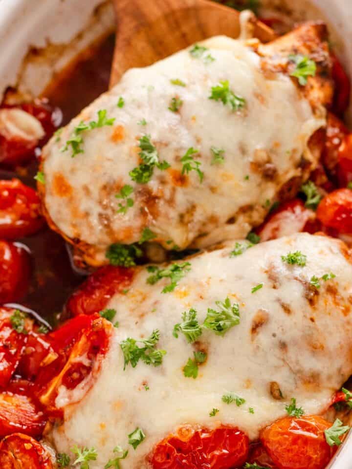 Chicken breast coated in balsamic marinade and baked with cherry tomatoes and mozzarella cheese.