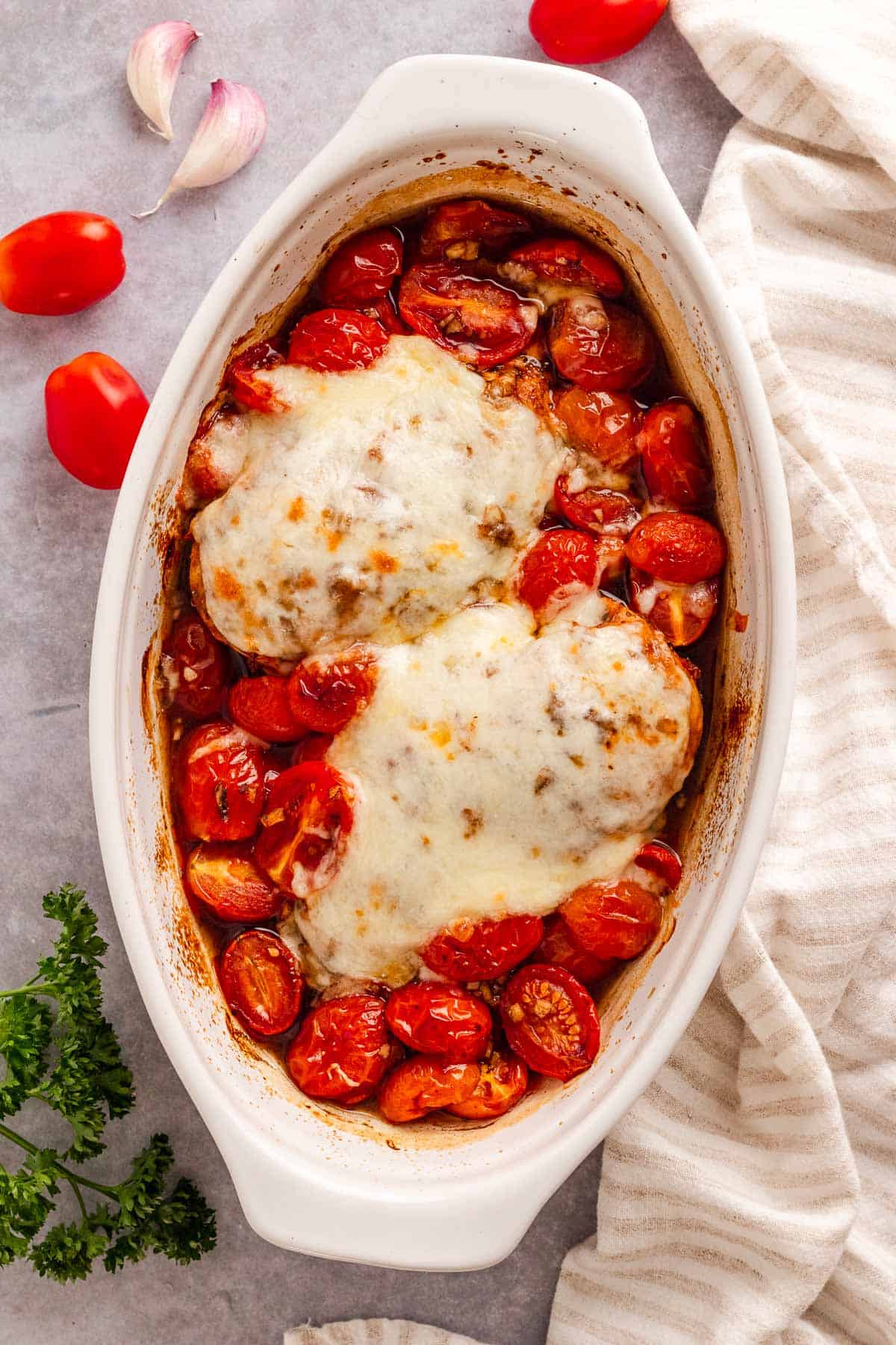 Chicken breast coated in balsamic marinade and baked with cherry tomatoes and mozzarella cheese.