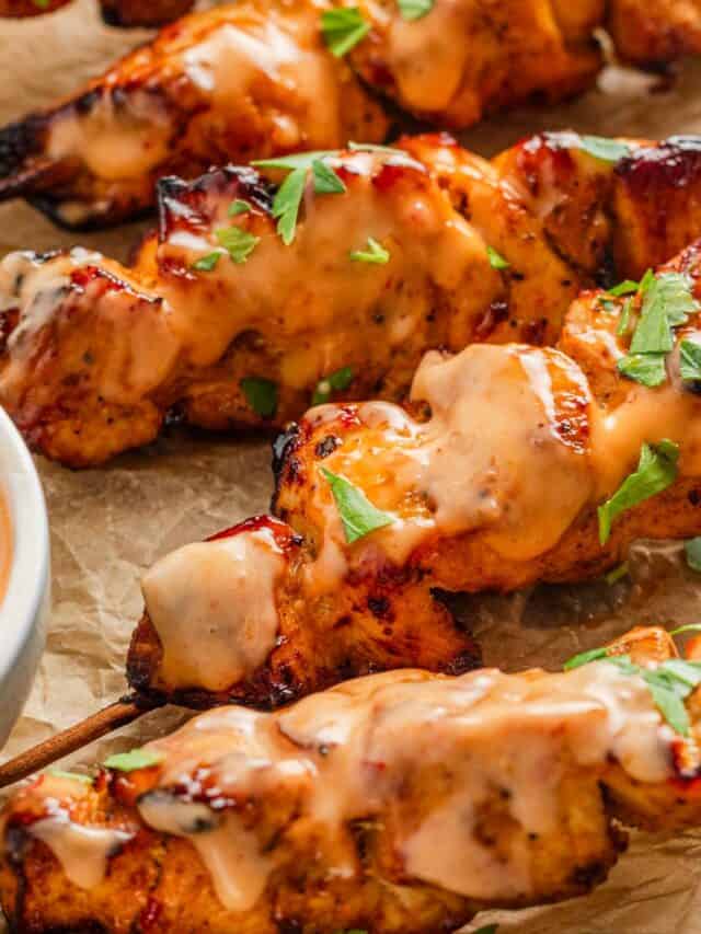 chicken skewers with bang bang sauce.