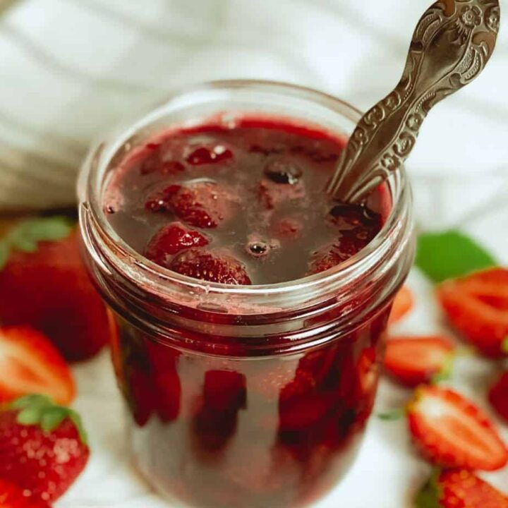 This homemade strawberry sauce is only 5 ingredients, and is the perfect berry topping to go on ice cream, cheesecake, pancakes, waffles, yogurt, biscuits and more!