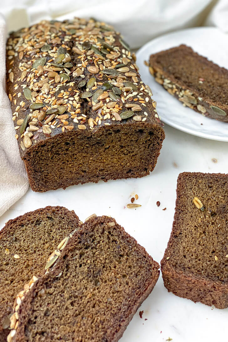 This Sunflower and Flaxseed Bread is a tender, moist, fiber-rich loaf that is packed with flaxseeds, sunflower, chia, and cumin seeds. This easy to make quick bread is perfect for breakfast, a mid-morning snack, or your favorite toasts spread.