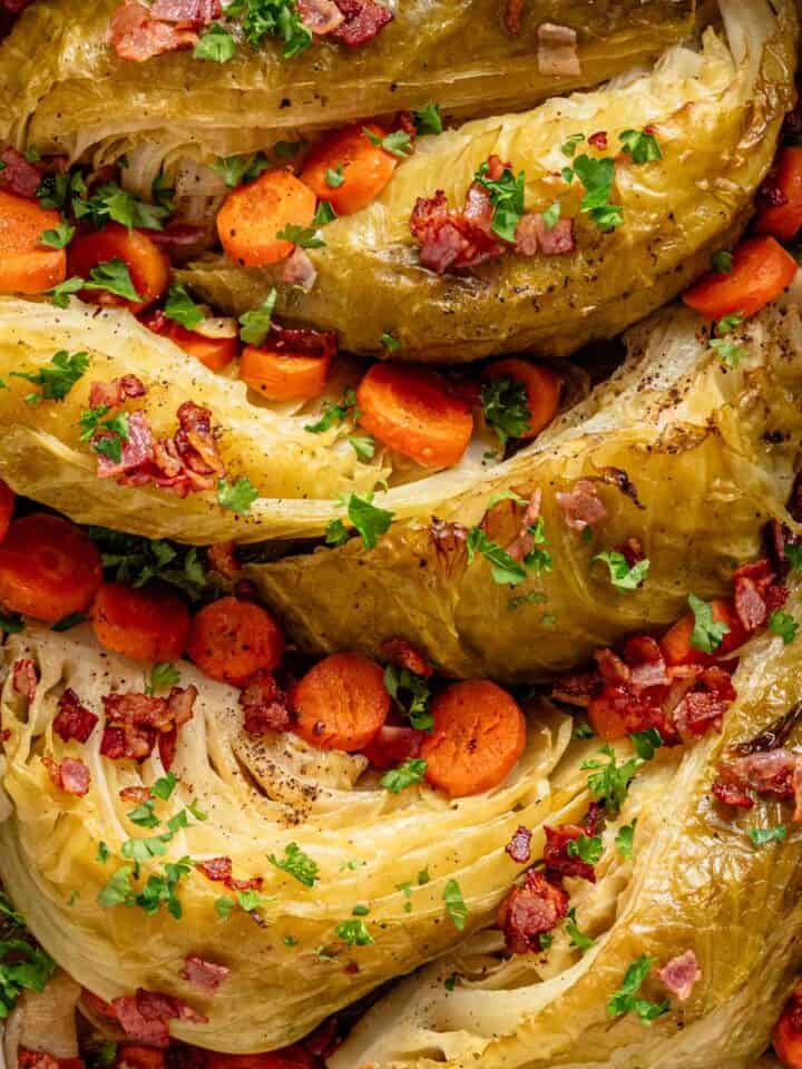 braised cabbage recipe with vegetables in casserole dish.