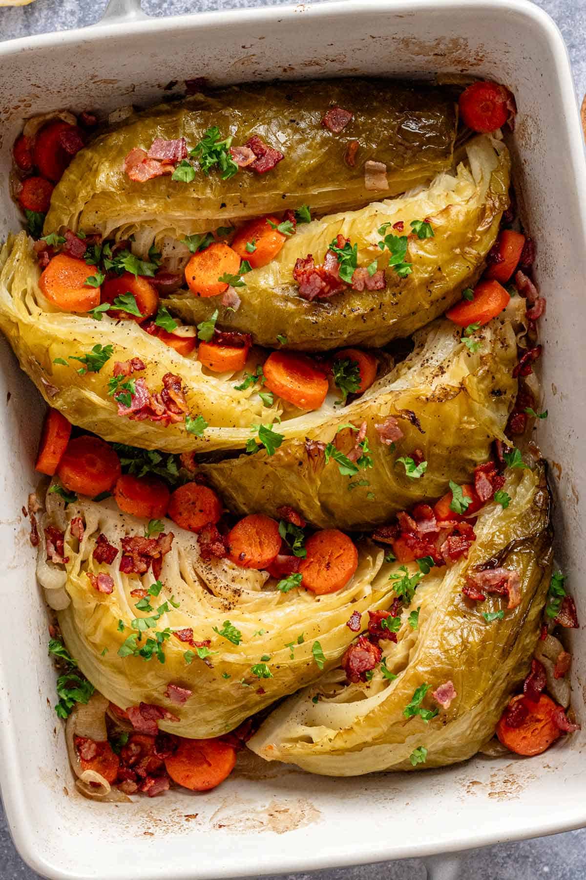 braised cabbage with vegetables in casserole dish.