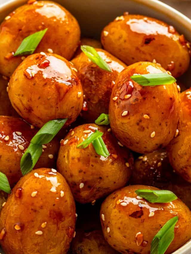 baby potatoes with dark sauce in skillet.