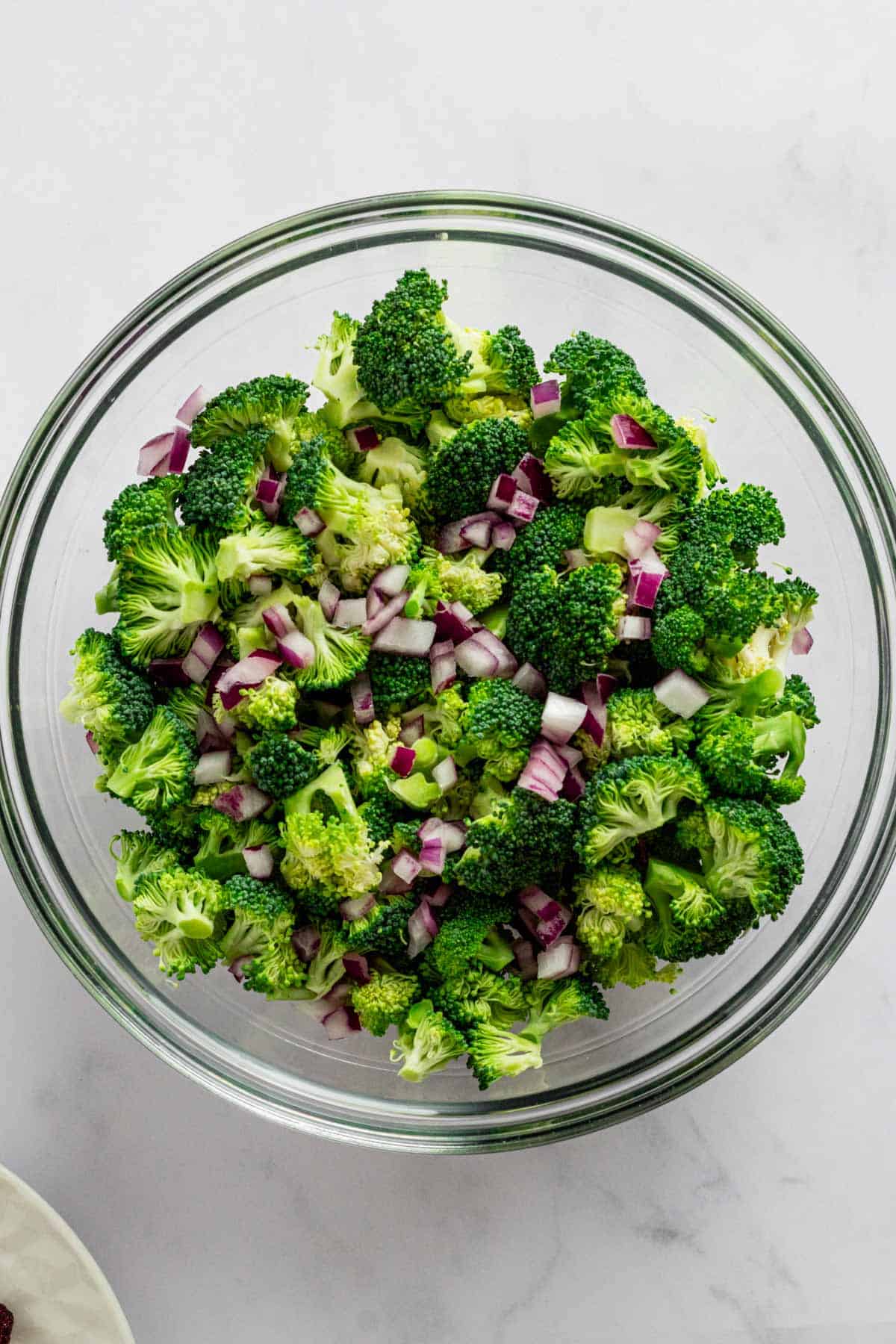 broccoli florets and onions in a bowl.