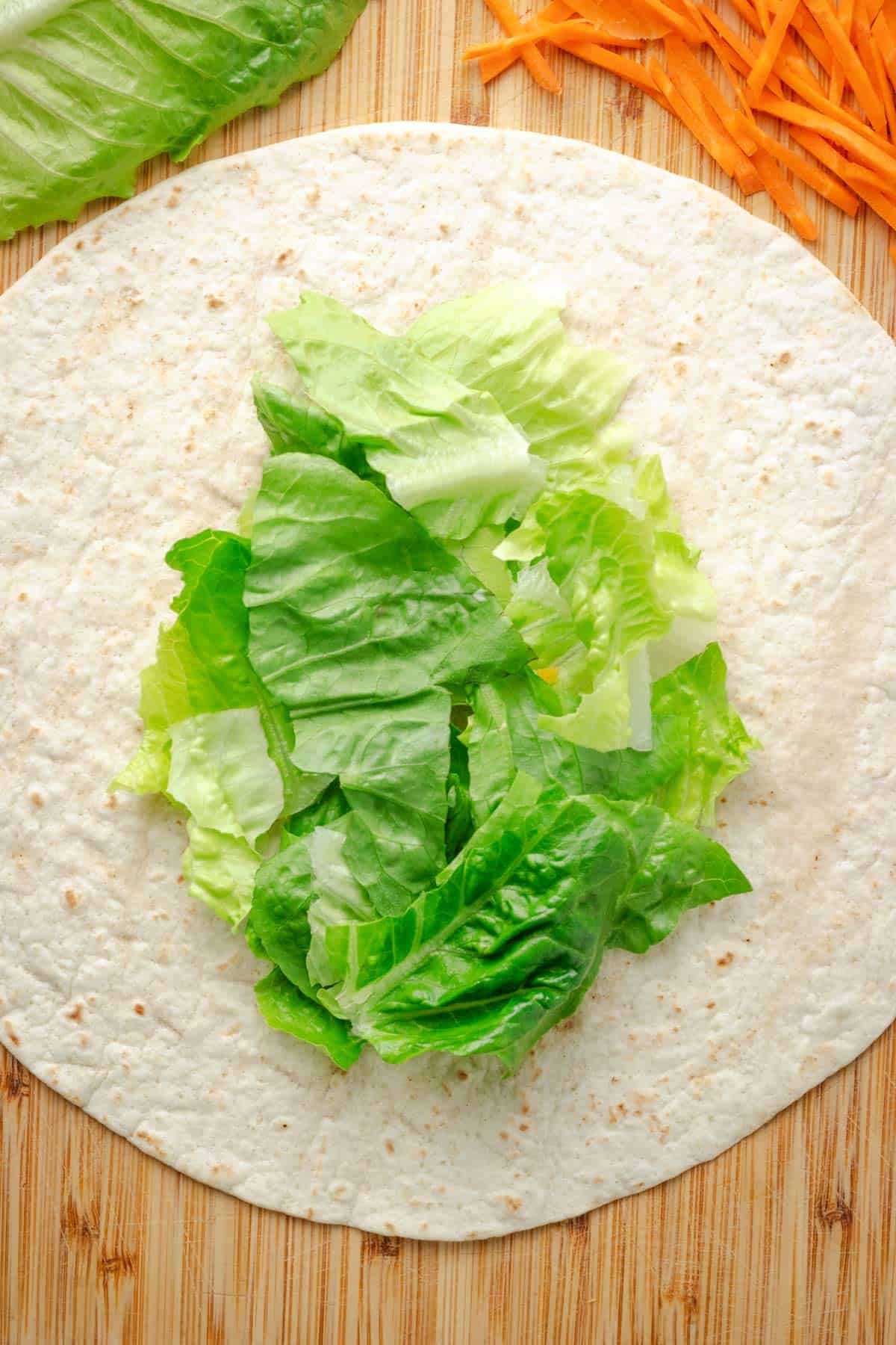 lettuce on top of tortilla.